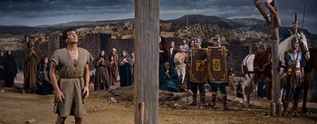 Movie still from “The Robe” (1953), directed by Henry Koster – A painting of a group of people gathered in a field; Extreme Wide shot, Low angle