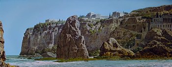 Movie still from “The Robe” (1953), directed by Henry Koster – A large rock formation in the middle of a river; Extreme Wide shot, Low angle