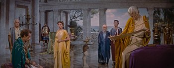 Movie still from “The Robe” (1953), directed by Henry Koster – A group of men and women standing next to each other; Wide shot, High angle