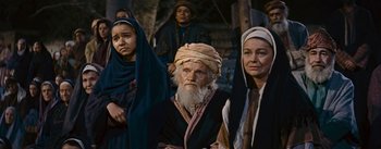 Movie still from “The Robe” (1953), directed by Henry Koster – A group of men and women standing next to each other; Medium shot, High angle