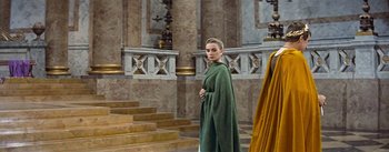 Movie still from “The Robe” (1953), directed by Henry Koster – A woman in a green robe standing in a room; Medium shot, Low angle