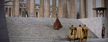 Movie still from “The Robe” (1953), directed by Henry Koster – A person walking down a set of stairs; Extreme Wide shot, High angle
