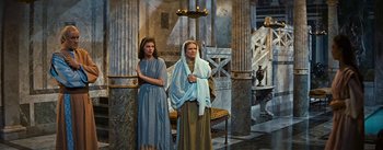 Movie still from “The Robe” (1953), directed by Henry Koster – Two women dressed in ancient roman clothing standing in a room; Wide shot, Low angle