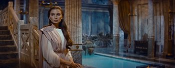 Movie still from “The Robe” (1953), directed by Henry Koster – A beautiful woman in a roman style dress; Medium shot, Over the shoulder angle
