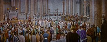 Movie still from “The Robe” (1953), directed by Henry Koster – A large crowd of people gathered together in a building; Extreme Wide shot, High angle