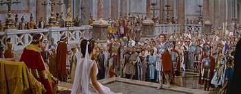 Movie still from “The Robe” (1953), directed by Henry Koster – A crowd of people standing in front of a building; Wide shot, High angle