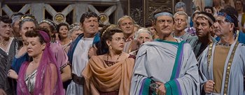 Movie still from “The Robe” (1953), directed by Henry Koster – A group of people standing next to each other wearing costumes; Medium shot, Low angle