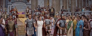 Movie still from “The Robe” (1953), directed by Henry Koster – A group of roman soldiers and a woman in a white dress; Wide shot, High angle