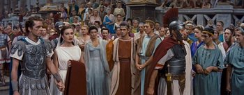 Movie still from “The Robe” (1953), directed by Henry Koster – A group of people standing in front of a crowd; Medium shot, High angle