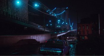 Movie still from “The Rose” (1979), directed by Mark Rydell – A car parked on the side of a road at night; Extreme Wide shot, Low angle