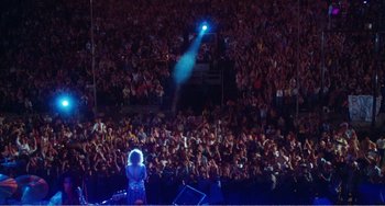 Movie still from “The Rose” (1979), directed by Mark Rydell – A large crowd of people watching a concert; Extreme Wide shot, High angle