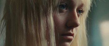Movie still from “The Runaways” (2010), directed by Floria Sigismondi – A woman's face with long blonde hair; Close Up shot, Low angle