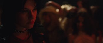 Movie still from “The Runaways” (2010), directed by Floria Sigismondi – A woman's face in the dark; Close Up shot, Over the shoulder angle