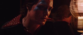 Movie still from “The Runaways” (2010), directed by Floria Sigismondi – A person with makeup on their face; Close Up shot, Over the shoulder angle