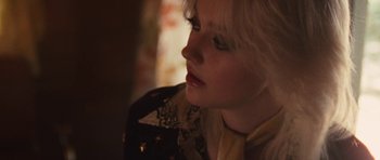 Movie still from “The Runaways” (2010), directed by Floria Sigismondi – A person with short blonde hair; Close Up shot, Over the shoulder angle