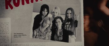 Movie still from “The Runaways” (2010), directed by Floria Sigismondi – A black and white photo of a group of women; Extreme Close Up shot, Overhead angle