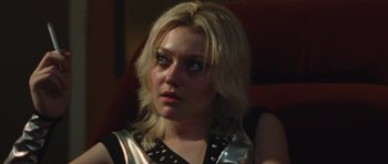 Movie still from “The Runaways” (2010), directed by Floria Sigismondi – A woman with blonde hair wearing a leather vest; Close Up shot, Low angle