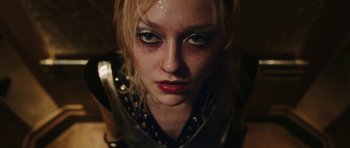 Movie still from “The Runaways” (2010), directed by Floria Sigismondi – A person wearing a costume; Close Up shot, Low angle