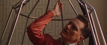 Movie still from “The Runaways” (2010), directed by Floria Sigismondi – A man in a red shirt holding an umbrella; Close Up shot, Overhead angle