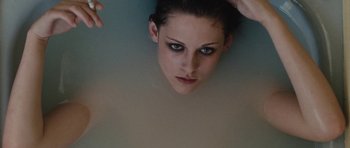 Movie still from “The Runaways” (2010), directed by Floria Sigismondi – A woman's face in a bath tub; Close Up shot, Overhead angle