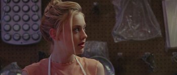 Movie still from “The Runaways” (2010), directed by Floria Sigismondi – A woman with blonde hair and a pink top; Close Up shot, Over the shoulder angle