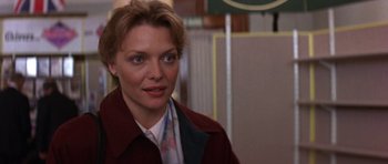 Movie still from “The Russia House” (1990), directed by Fred Schepisi – A person wearing a jacket; Close Up shot, Over the shoulder angle