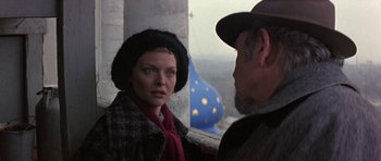 Movie still from “The Russia House” (1990), directed by Fred Schepisi – A man and a woman looking at one another; Close Up shot, Over the shoulder angle