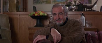 Movie still from “The Russia House” (1990), directed by Fred Schepisi – An older man sitting in front of a bowl of fruit; Close Up shot, Low angle