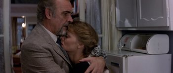 Movie still from “The Russia House” (1990), directed by Fred Schepisi – An older man and a younger woman kissing; Close Up shot, Low angle
