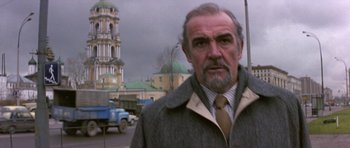 Movie still from “The Russia House” (1990), directed by Fred Schepisi – A person wearing a coat and tie; Close Up shot, Low angle