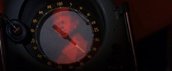 Movie still from “The Russians Are Coming the Russians Are Coming” (1966), directed by Norman Jewison – A speedometer with a red light on it; Extreme Close Up shot, Overhead angle
