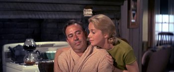 Movie still from “The Russians Are Coming the Russians Are Coming” (1966), directed by Norman Jewison – A man and a woman sitting next to each other; Close Up shot, Low angle