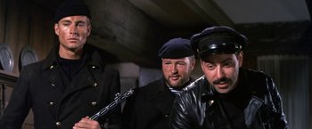 Movie still from “The Russians Are Coming the Russians Are Coming” (1966), directed by Norman Jewison – A group of men standing next to each other; Medium shot, Low angle