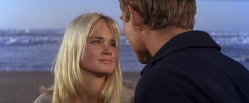Movie still from “The Russians Are Coming the Russians Are Coming” (1966), directed by Norman Jewison – A man and a woman looking at one another; Close Up shot, Over the shoulder angle