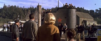 Movie still from “The Russians Are Coming the Russians Are Coming” (1966), directed by Norman Jewison – A group of people standing on top of a boat; Wide shot, Low angle