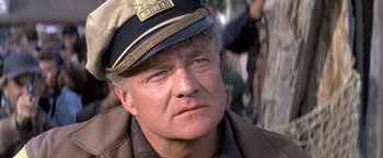 Movie still from “The Russians Are Coming the Russians Are Coming” (1966), directed by Norman Jewison – A person wearing a hat; Close Up shot, Low angle