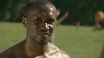 Movie still from “The Sacrament” (2013), directed by Ti West – A man's face in a field; Close Up shot, Low angle