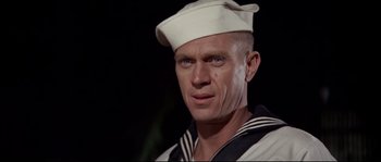 Movie still from “The Sand Pebbles” (1966), directed by Robert Wise – A man in a sailor's uniform with blue eyes; Close Up shot, Low angle