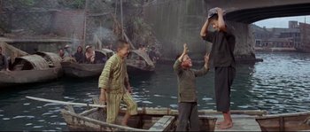Movie still from “The Sand Pebbles” (1966), directed by Robert Wise – A group of young boys on a boat in the water; Wide shot, High angle