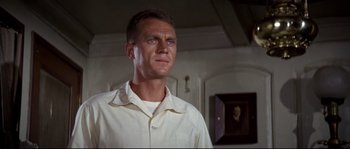 Movie still from “The Sand Pebbles” (1966), directed by Robert Wise – A person wearing a white shirt; Close Up shot, Low angle