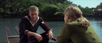 Movie still from “The Sand Pebbles” (1966), directed by Robert Wise – A man and a woman sitting in a boat on a river; Medium shot, Over the shoulder angle