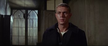 Movie still from “The Sand Pebbles” (1966), directed by Robert Wise – A person wearing a jacket; Close Up shot, Over the shoulder angle