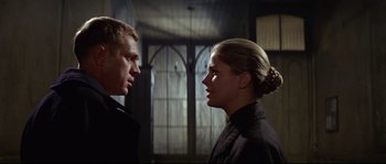 Movie still from “The Sand Pebbles” (1966), directed by Robert Wise – A man and a woman standing next to each other; Close Up shot, Low angle