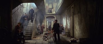 Movie still from “The Sand Pebbles” (1966), directed by Robert Wise – A group of people standing in an old building; Wide shot, High angle