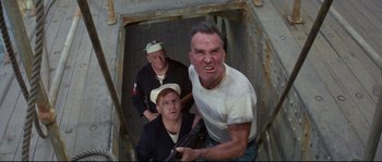 Movie still from “The Sand Pebbles” (1966), directed by Robert Wise – A group of men standing next to each other holding guns; Medium shot, Low angle