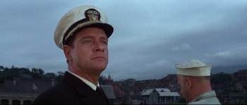 Movie still from “The Sand Pebbles” (1966), directed by Robert Wise – A person wearing a hat; Close Up shot, Low angle