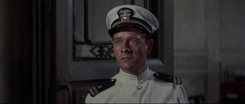Movie still from “The Sand Pebbles” (1966), directed by Robert Wise – A person wearing a uniform; Close Up shot, High angle