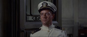 Movie still from “The Sand Pebbles” (1966), directed by Robert Wise – A person wearing a uniform; Close Up shot, Low angle