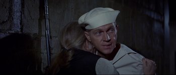 Movie still from “The Sand Pebbles” (1966), directed by Robert Wise – A man and a woman are hugging in the dark; Close Up shot, High angle