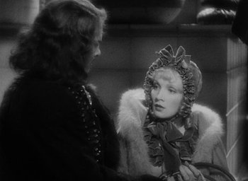 Movie still from “The Scarlet Empress” (1934), directed by Josef von Sternberg – An old photo of a man and a woman talking to each other; Close Up shot, Over the shoulder angle
